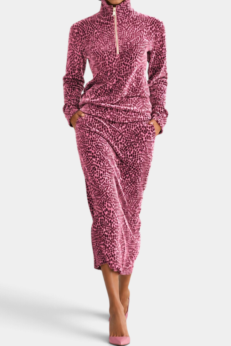 Mahaute Avdotya pink animal print midi skirt set with a long-sleeve zip-up mock neck top.