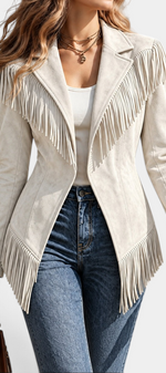 Mahaute beige faux suede jacket with long fringe detailing, tailored collar, and a fitted silhouette.