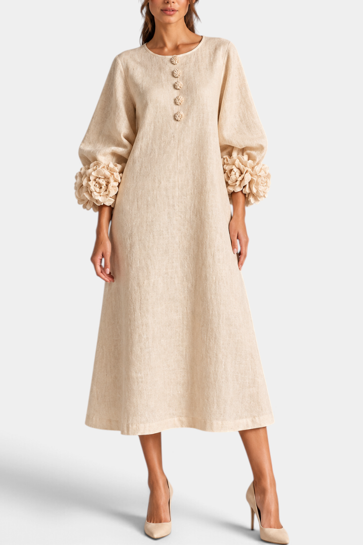 Mahaute beige midi dress with puff sleeves, 3D floral cuffs, and decorative front buttons.