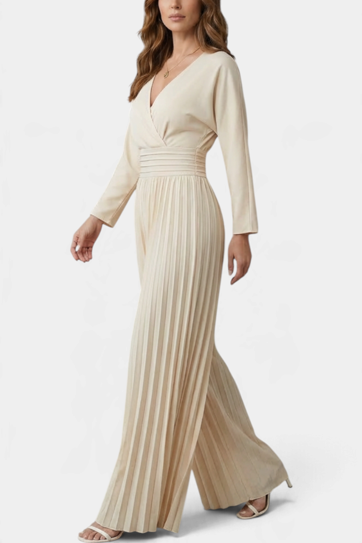 Mahaute beige long-sleeve jumpsuit with a V-neck wrap bodice, high waist, and wide-leg pleated trousers.