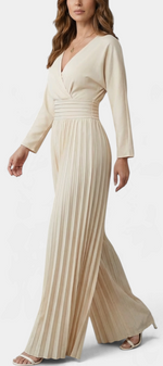 Mahaute beige long-sleeve jumpsuit with a V-neck wrap bodice, high waist, and wide-leg pleated trousers.