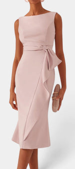 Mahaute Billini blush pink midi dress with boat neckline, side-tied waist, and elegant asymmetrical draped skirt.