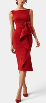 Mahaute Billini red midi dress with boat neckline, side tie waist, and elegant asymmetrical draped skirt detail.
