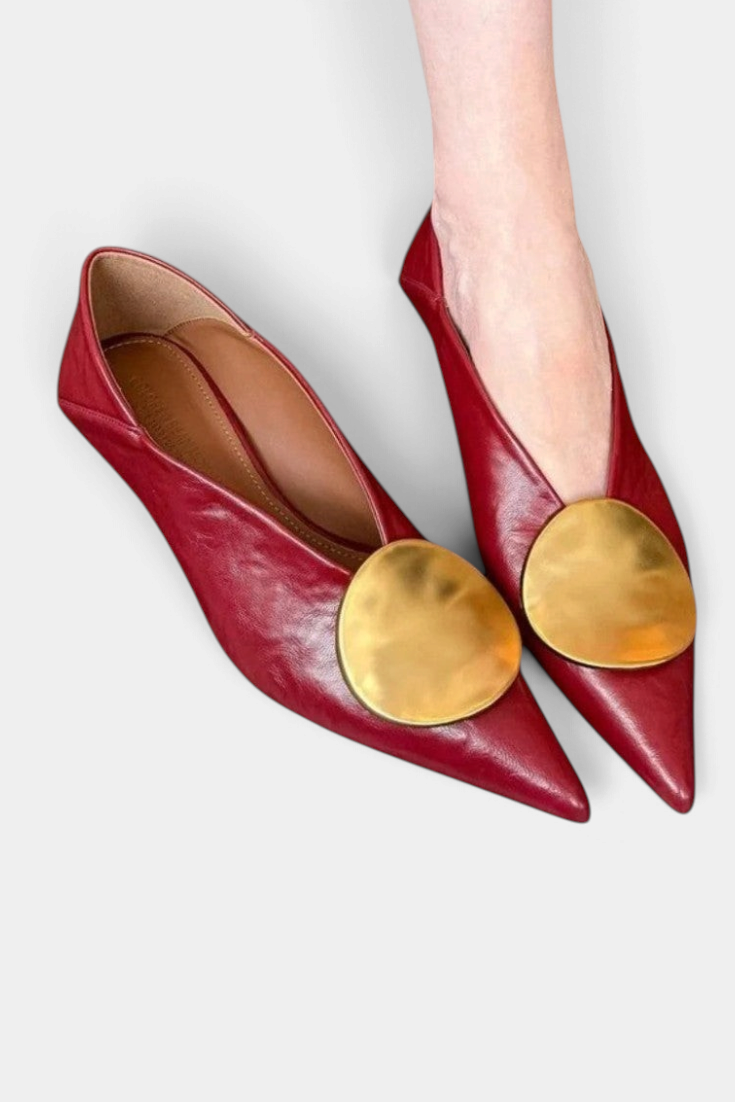 Mahaute Billini red pointed-toe kitten heel pumps featuring a large gold metallic circular ornament on the front