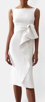 Mahaute white midi dress featuring a boat neckline, side-tie waist, and elegant asymmetrical draped skirt detail.