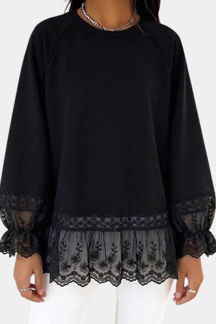 Mahaute black fluid blouse with 3/4 lace sleeves, floral lace hem, and ruffled cuffs for a feminine elegant look.