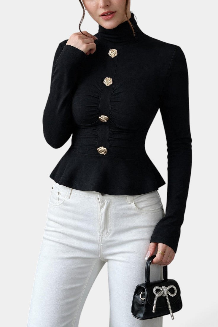 Haut péplum noir Mahaute avec col roulé, fronces et boutons bijoux, tissu élégant et détails mode raffinés.