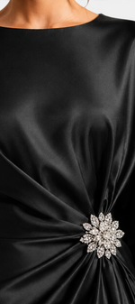 Mahaute black satin evening dress with draped waist and sparkling crystal brooch detail