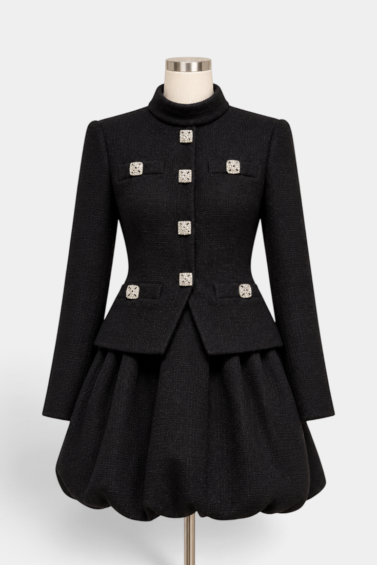 Mahaute black structured jacket and bubble skirt set featuring square crystal jewel buttons and a high collar.