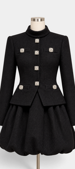 Mahaute black structured jacket and bubble skirt set featuring square crystal jewel buttons and a high collar.