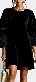 Mahaute Fuega black velvet short dress with voluminous puff sleeves and 3D floral details on the cuffs.