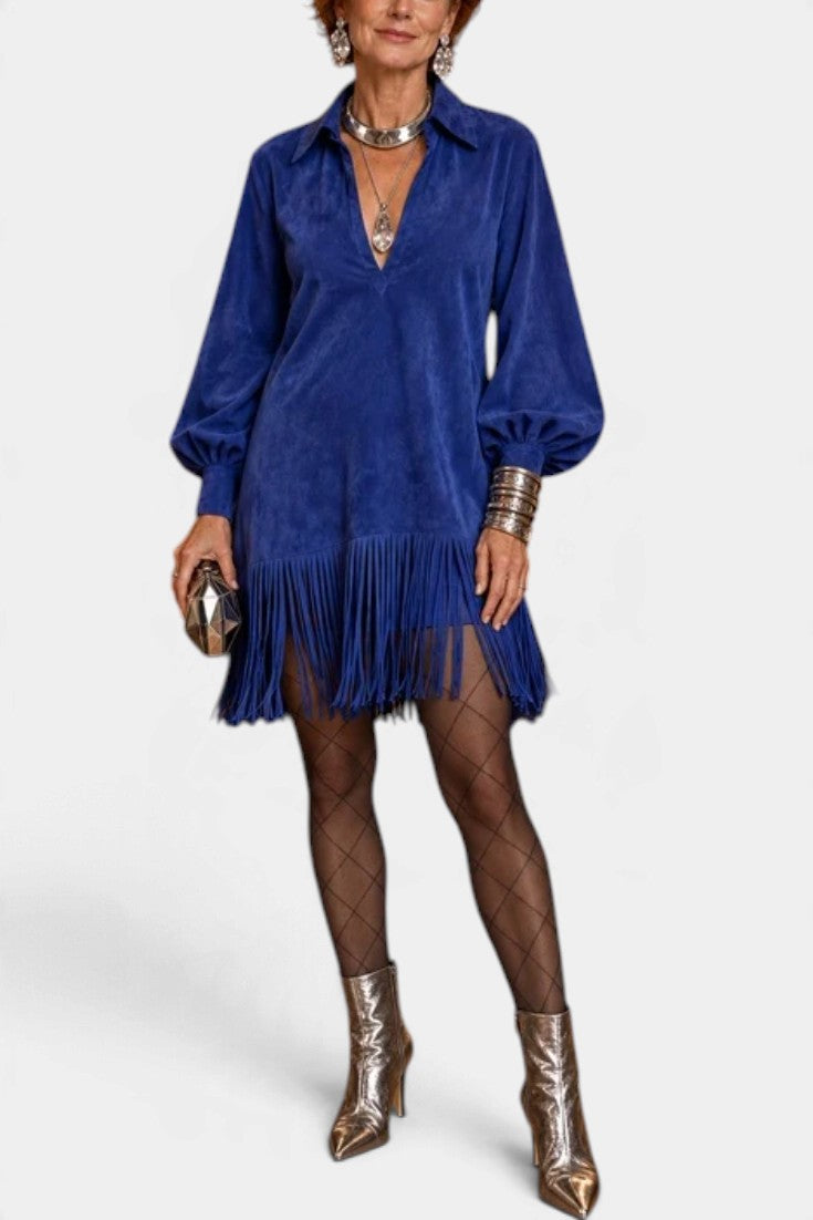 Mahaute royal blue suede-effect mini dress with fringe hem, puff sleeves, and collared neckline on a model.