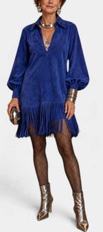 Mahaute royal blue suede-effect mini dress with fringe hem, puff sleeves, and collared neckline on a model.