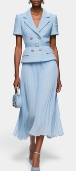 Mahaute light blue textured short-sleeve blazer with gold buttons, belted waist, and matching pleated midi skirt.