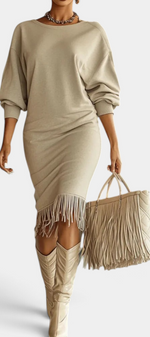 Mahaute Bozhidara beige midi dress with batwing sleeves, side ruching, and a fringe hem worn with matching boots.