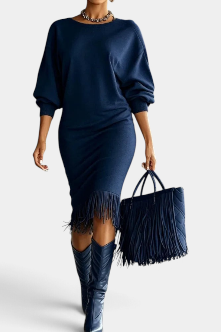 Mahaute Bozhidara navy blue midi dress with batwing sleeves, side ruching, and a fringe hem worn with matching boots.