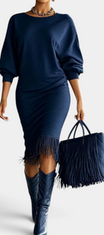 Mahaute Bozhidara navy blue midi dress with batwing sleeves, side ruching, and a fringe hem worn with matching boots.