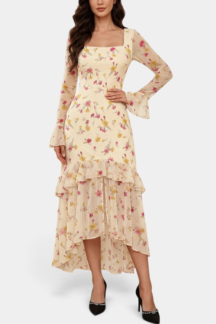 Robe longue Mahaute Brianda à imprimé floral, asymétrique, encolure carrée, avec volants, portée élégante et fluide.