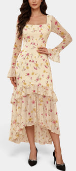 Robe longue Mahaute Brianda à imprimé floral, asymétrique, encolure carrée, avec volants, portée élégante et fluide.