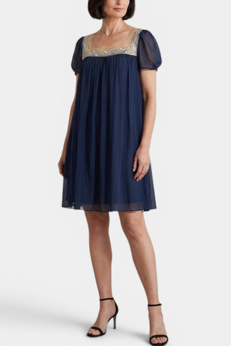 Mahaute Briony short navy blue dress with square neck, floral embroidery, and sheer butterfly sleeves.