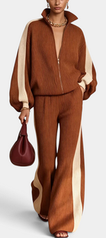 Mahaute ribbed knit set with brown zip-up jacket and wide-leg trousers featuring cream contrast side stripes