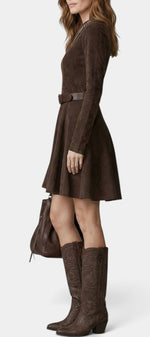 Mahaute brown suede skater dress with long sleeves, belted waist, and flared skirt worn with tall embroidered boots