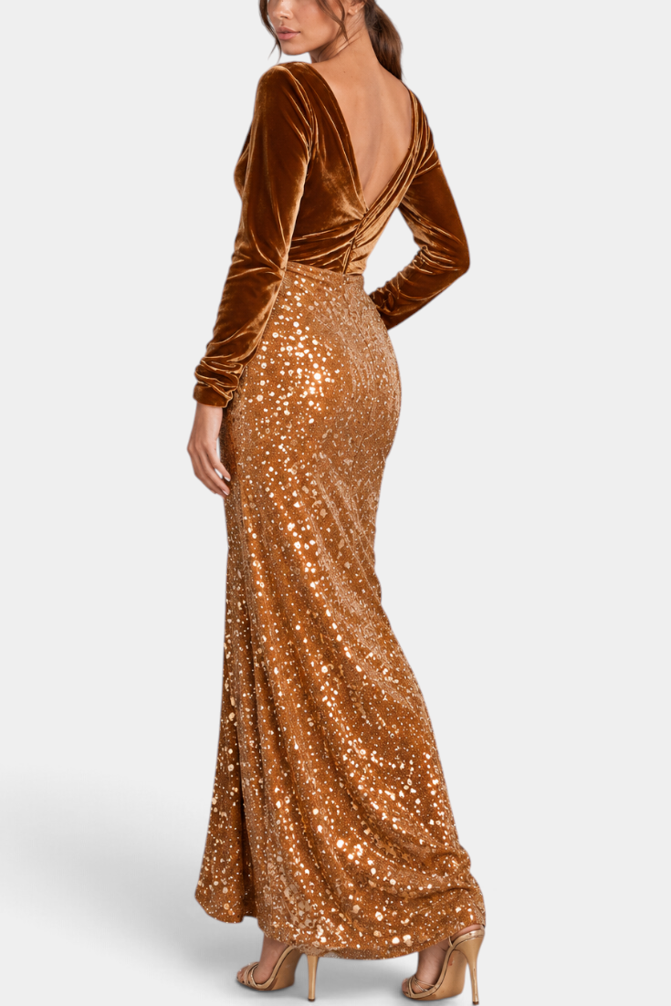 Model wearing Mahaute long evening gown with brown velvet bodice, V-back, and shimmering sequin skirt.