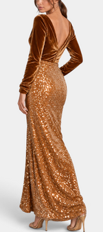 Model wearing Mahaute long evening gown with brown velvet bodice, V-back, and shimmering sequin skirt.