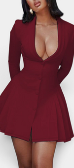 Mahaute Thelma short burgundy blazer dress with deep V-neck, cinched waist, and pleated skirt on a model