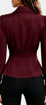 Mahaute burgundy long-sleeve blouse with tailored collar, cinched waist, and gold button cuffs, back view.