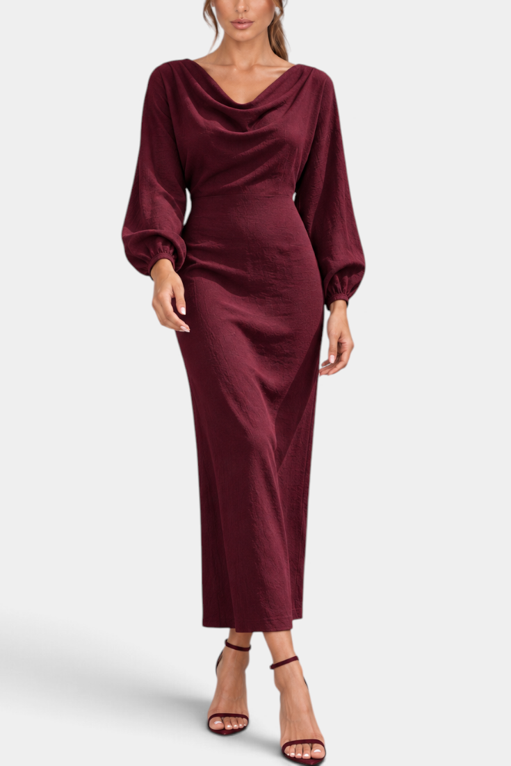 Mahaute Nicole long burgundy dress with draped cowl neck, balloon sleeves, and textured fabric on a model.