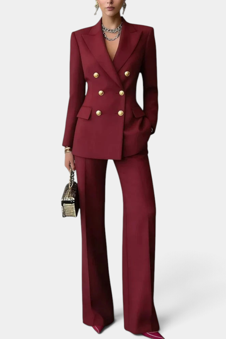 Mahaute Nadezhda burgundy double-breasted blazer and wide-leg trouser suit with gold buttons for formal occasions.