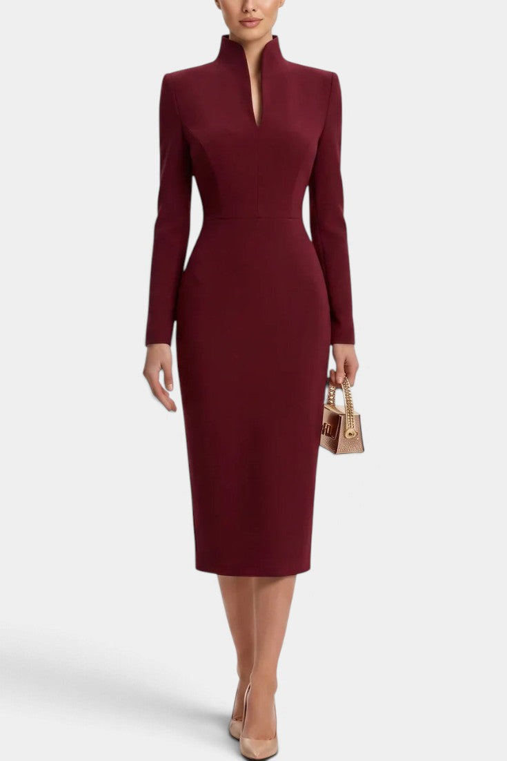 Mahaute Sandy burgundy midi dress with long sleeves, fitted waist, and a modern split mock neck collar.