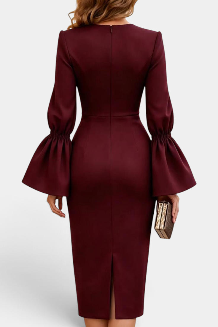 Back view of Mahaute Demelza burgundy midi sheath dress with dramatic flared sleeves and back slit