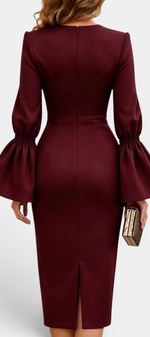 Back view of Mahaute Demelza burgundy midi sheath dress with dramatic flared sleeves and back slit