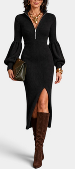 Mahaute Calyra black ribbed midi dress with balloon sleeves, front zip collar, and leg slit worn with brown boots.