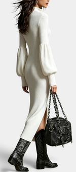 Mahaute Calyra cream ribbed knit midi dress with balloon sleeves, zip collar, and side slit worn with western boots