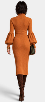 Mahaute Calyra rust orange ribbed knit midi dress with balloon sleeves and high neck, back view on a model