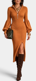 Mahaute Calyra rust orange ribbed knit midi dress with balloon sleeves, zip collar, and front slit worn with boots.
