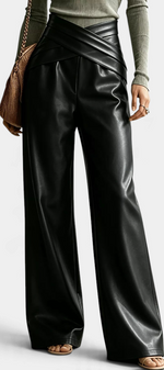 Mahaute Camellia black faux leather wide-leg trousers featuring a stylish crossover waistband and front pleats.