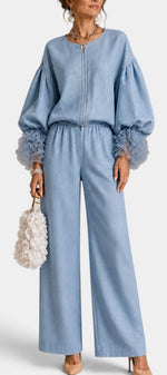 Mahaute Carrie light blue zip-up top with puff sleeves and ruffled cuffs paired with matching wide-leg trousers