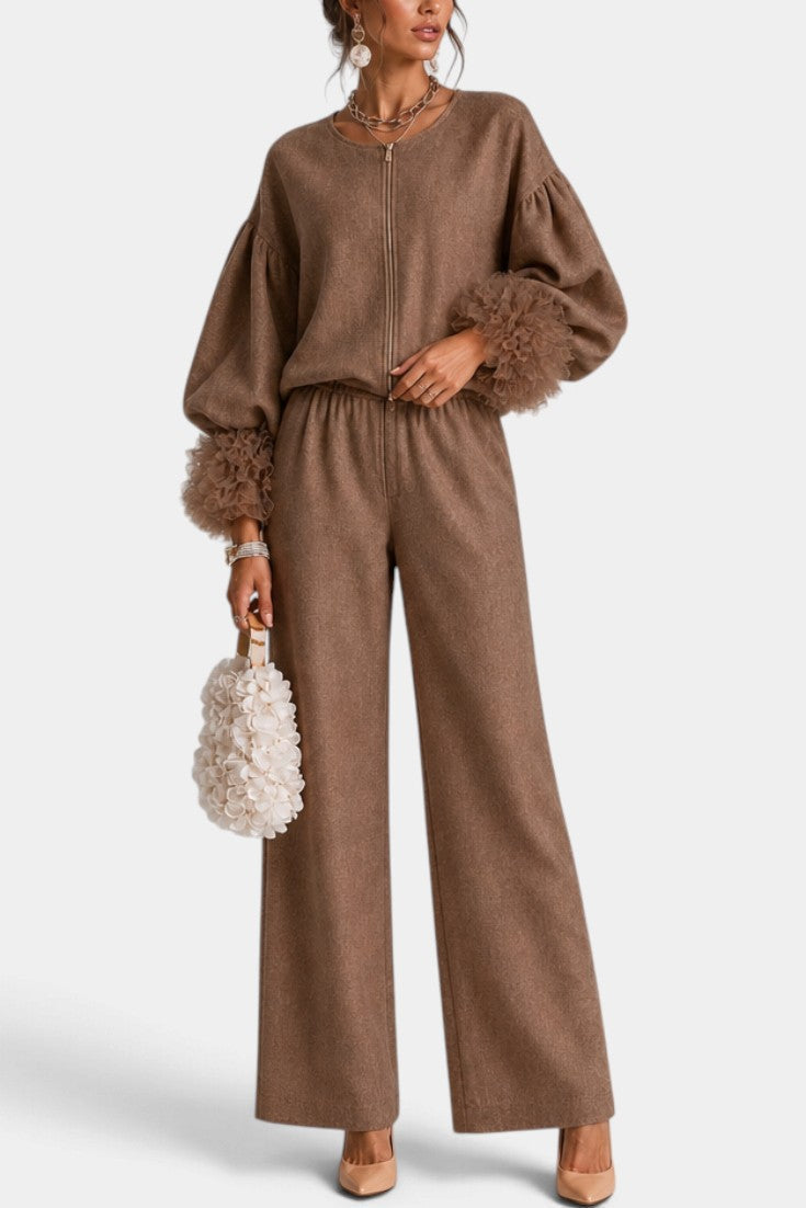Mahaute Carrie brown zip-up set with voluminous puff sleeves, textured ruffled cuffs, and wide-leg trousers.