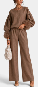 Mahaute Carrie brown zip-up set with voluminous puff sleeves, textured ruffled cuffs, and wide-leg trousers.