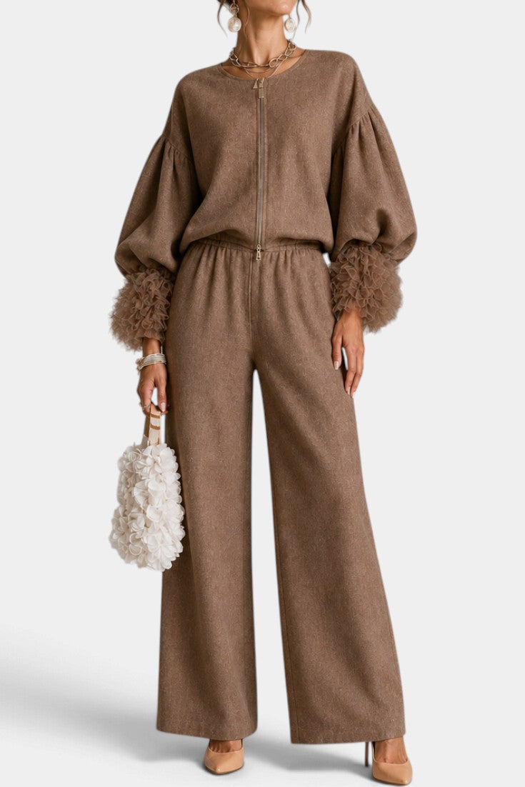 Mahaute Carrie brown zip-up set with voluminous puff sleeves, textured cuffs, and wide-leg trousers on a model.