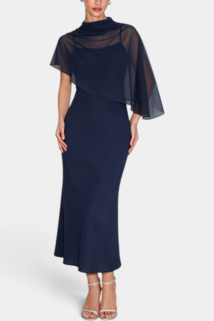 Mahaute Carys navy blue midi dress with a draped cowl neck and sheer asymmetrical cape overlay for formal events.