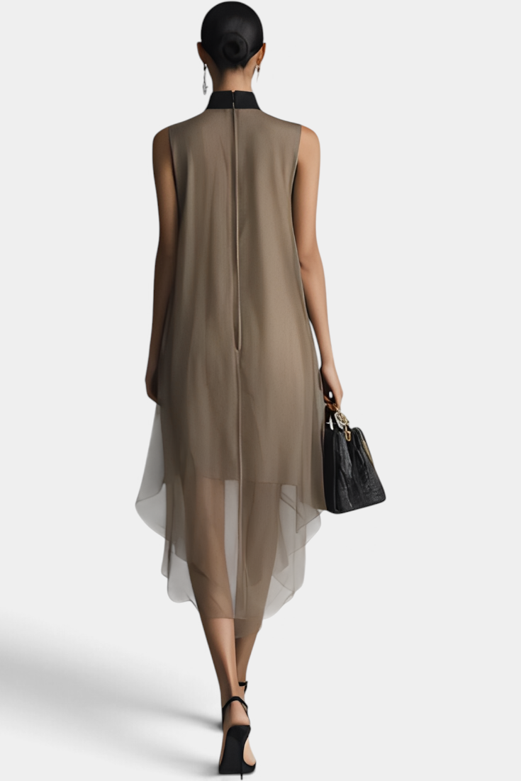 Back view of a model wearing a Mahaute Cecily taupe asymmetrical midi dress with a black lavalliere collar in sheer voile.