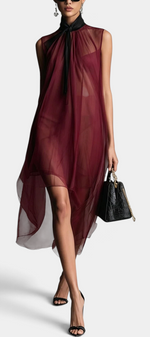 Mahaute Cecily burgundy asymmetrical midi dress in sheer voile with a black lavalliere collar worn by a model.