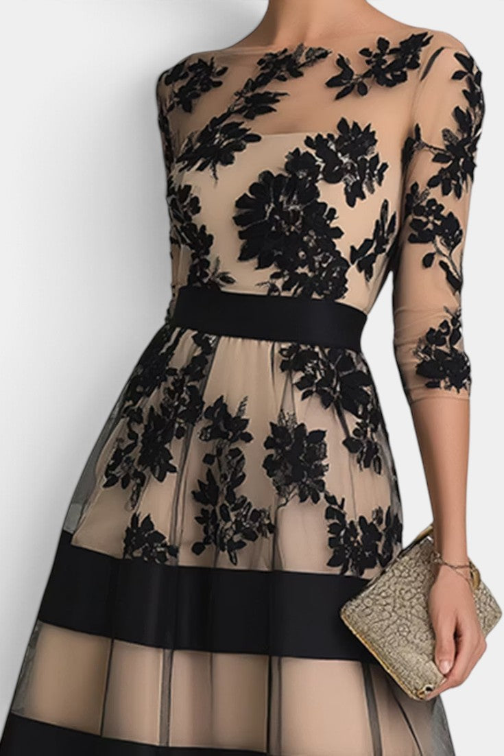 Robe mi-longue Mahaute Celia en tulle brodé floral, manches 3/4, élégante et légère, parfaite pour une occasion spéciale.