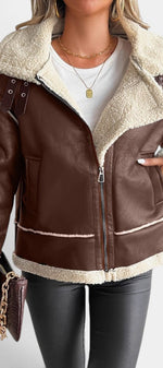 Mahaute Clarimonde brown faux leather aviator jacket with cream faux shearling collar, zip closure, and buckle straps.