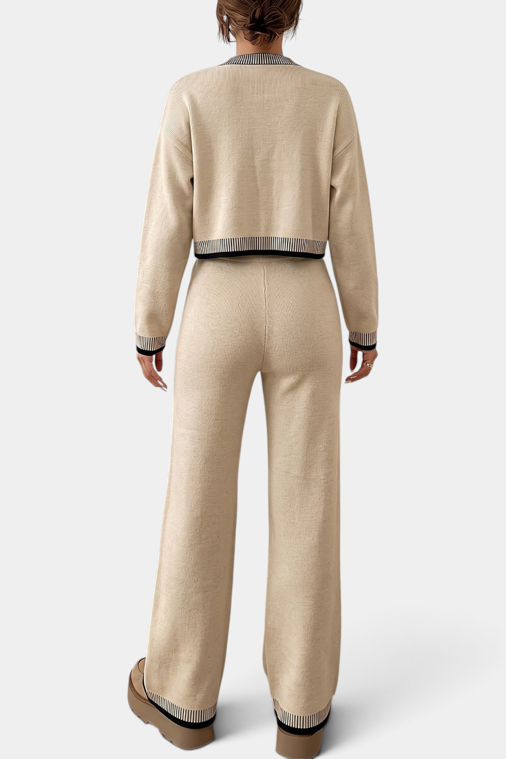 Back view of Mahaute Clemency beige knit lounge set with black and white striped trim on cardigan and wide-leg pants.